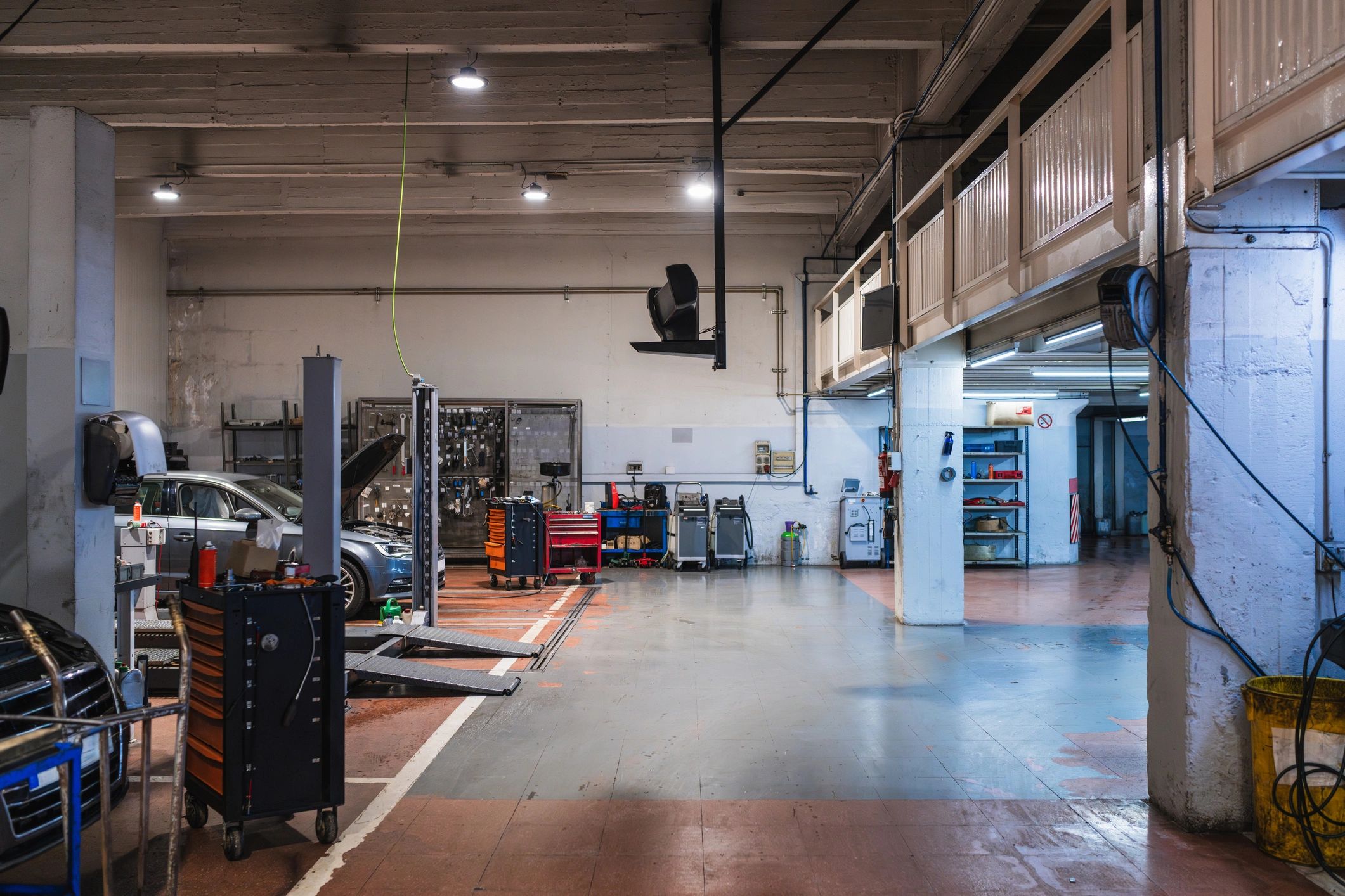 Automotive repair shop interior with service bays